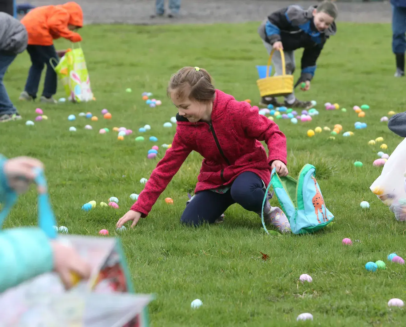 Adeline Murray collects eggs during the annual Easter egg hunt in North Canton in this file photo from April 2022.